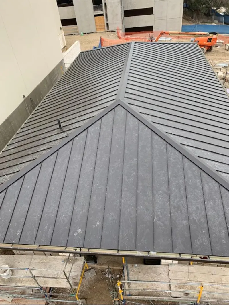 Commercial metal roof construction with crane equipment in Waynesboro